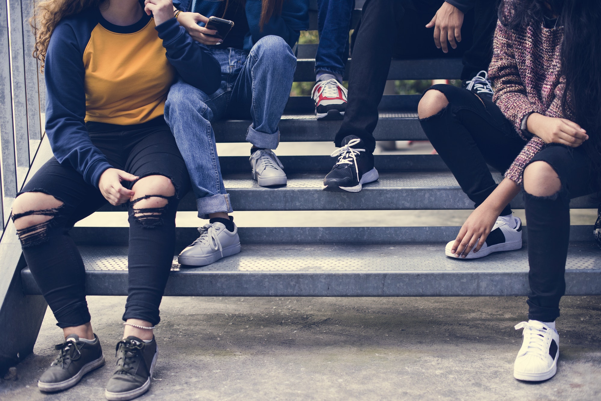 Group of school friends outdoors lifestyle and after school hangout concept